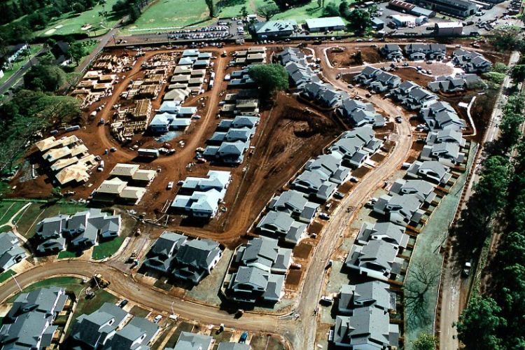 Aerial view of residential housing construction at Schofield Barracks, showing completed homes and ongoing development.