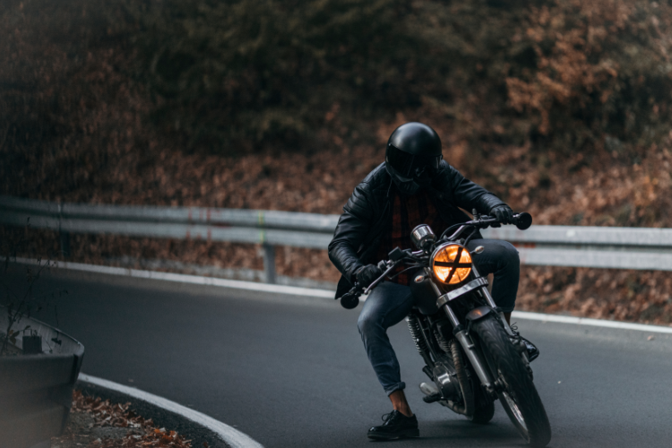 Motorcyclist Riding Street Bike On Curved Road