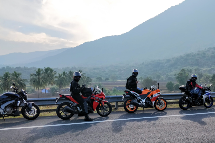 Different Types Motorcycles Parked Along Scenic Road