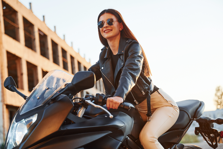 Woman Riding Motorcycle With Easy Handling