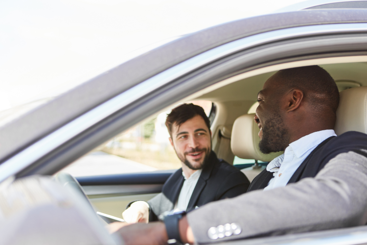 Two men negotiating inside parked car