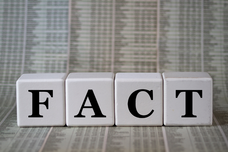 White blocks spelling FACT on data background
