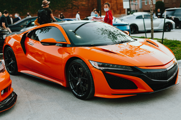 Bright orange sports car at show