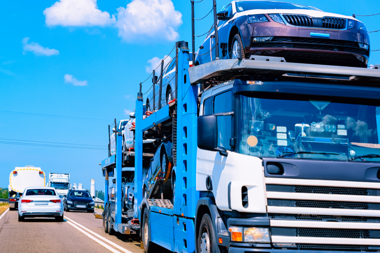 Car carrier truck transporting multiple new vehicles