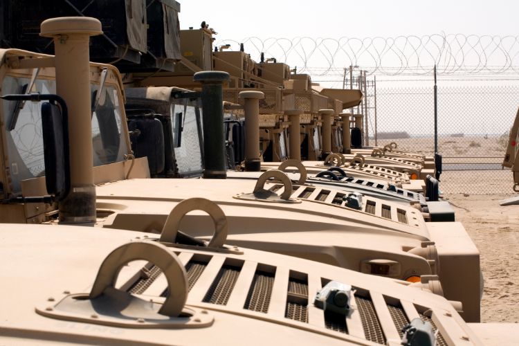 Military Armored Vehicles Parked in Desert