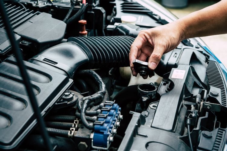 Inspecting Radiator Cap on Used Car