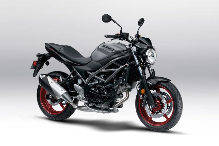 Black Suzuki SV650 motorcycle with red wheels