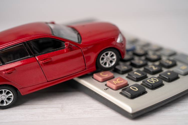 Red Toy Car On Calculator Keys
