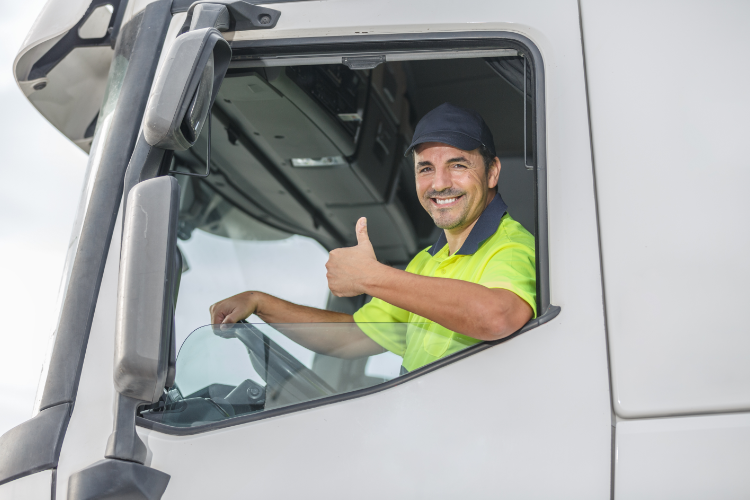 Smiling Truck Driver Giving Thumbs Up