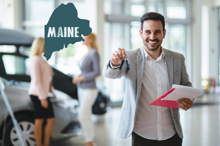 Smiling Car Dealer Holding Keys In Maine