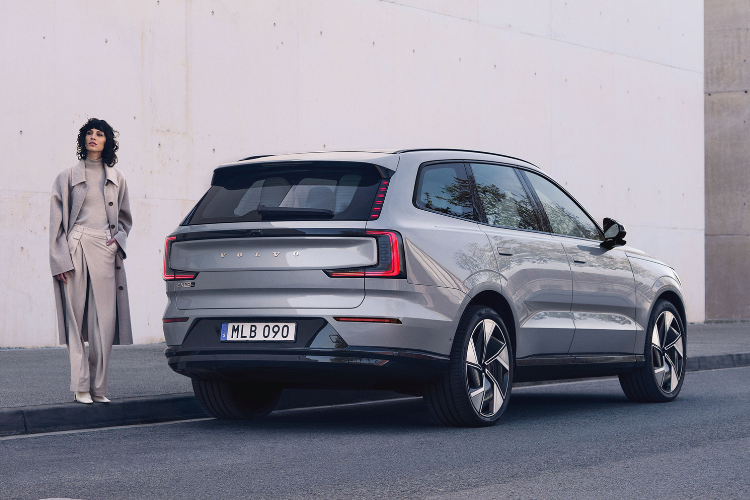 Volvo SUV Parked With Stylish Woman