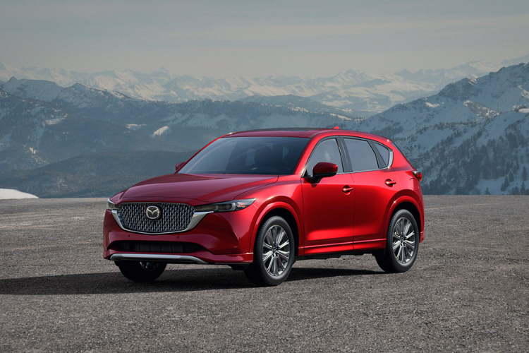 Red Mazda SUV Parked In Mountain Landscape
