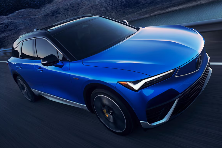 Blue Honda SUV Driving On Mountain Road