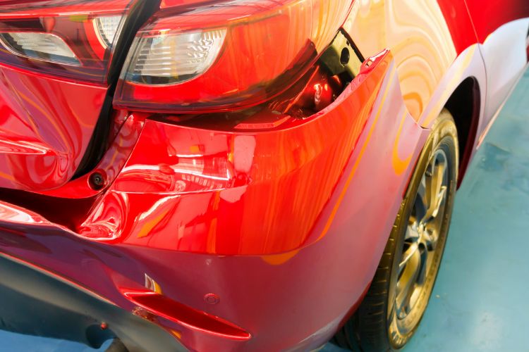 Red Car With Rear Bumper Damage