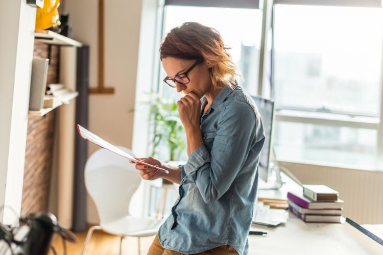 Woman Reviewing Quote And Payment Terms