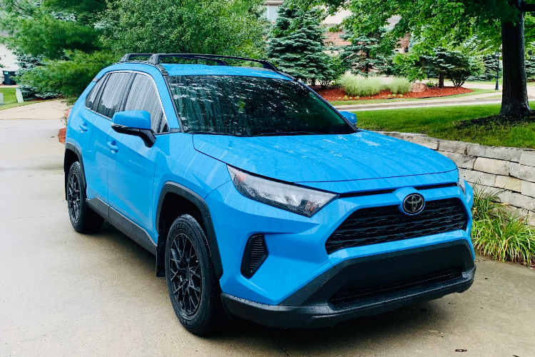 Blue Toyota SUV Parked On Driveway