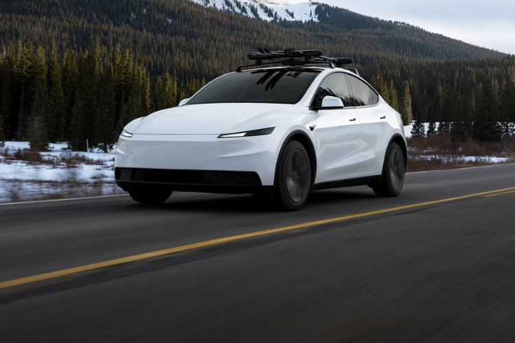 White Tesla Driving On Mountain Road