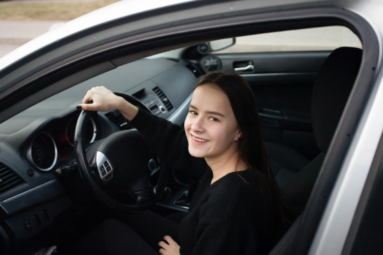 College Student Driving Car During Shopping