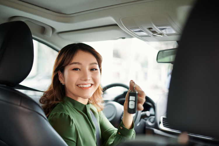 Student Holding Car Keys After Purchase