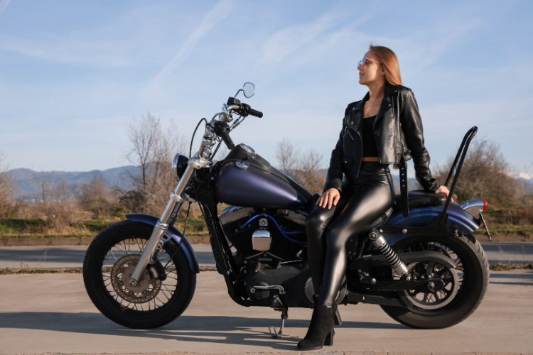 Woman Sitting On Touring Motorcycle Outdoors