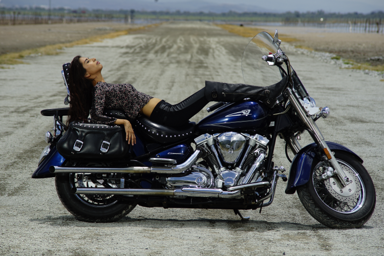 Woman Relaxing On Cruiser Touring Motorcycle