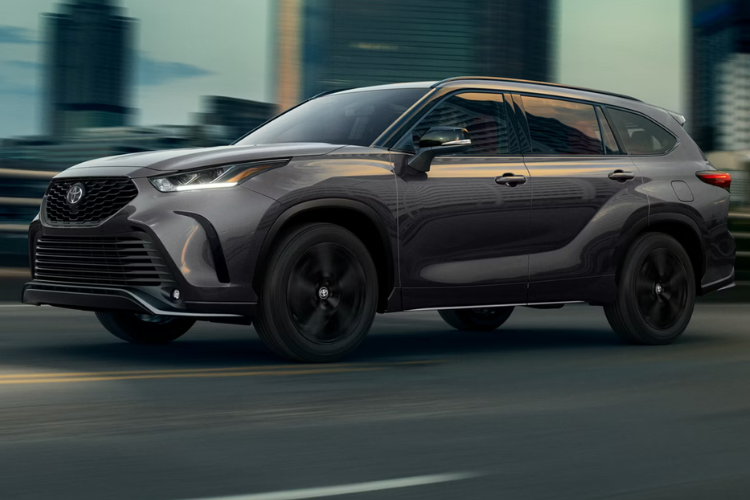Gray Toyota Highlander Driving Through City