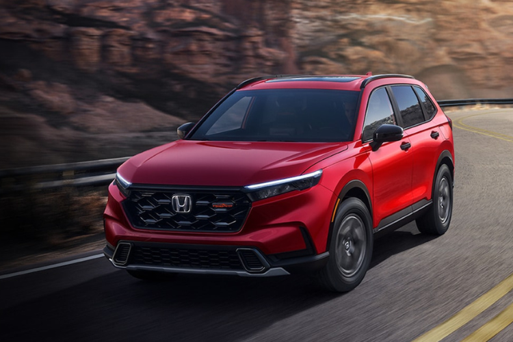 Red Honda CR-V Driving Mountain Highway