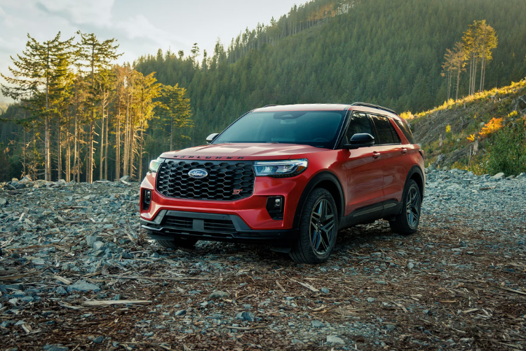 Red Ford Explorer In Forest Terrain