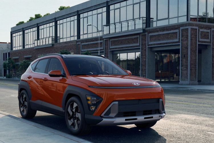 Orange Hyundai Kona Parked Near Buildings