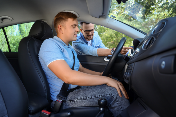 Man Test Driving Car With Dealer